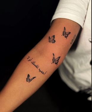 tiny butterfly tattoo